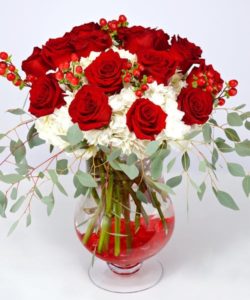 Red roses and white hydrangea in a vase