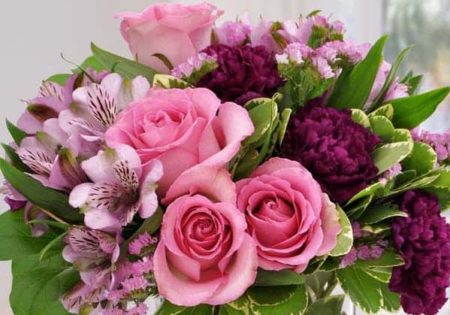 Pretty pink roses with soft lavender carnations and alstromeria highlight this delightful bouquet