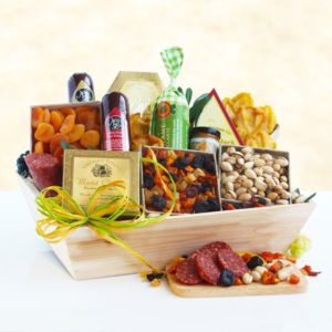 Gift basket full of snacks in wooden box